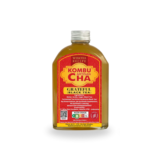 Bottle of Wisktea Recipe Artisan KombuCha Grateful Black Tea with a red label on a white background