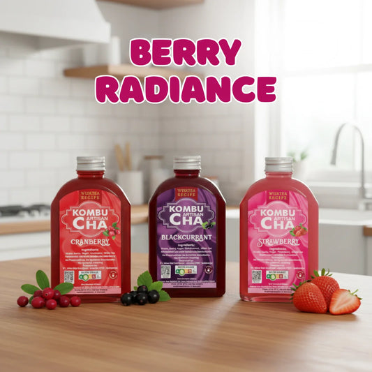 Three bottles of berry series KombuCha with berry ingredients on a kitchen counter, labeled 'Berry Radiance'.