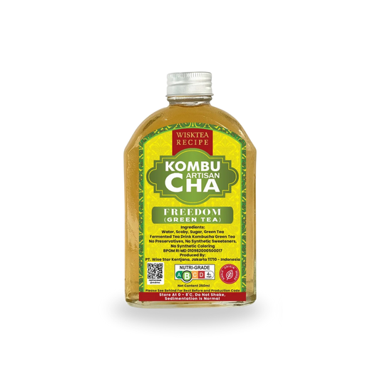 Bottle of Wisktea Recipe Artisan KombuCha Freedom Green Tea with a yellow label on a white background
